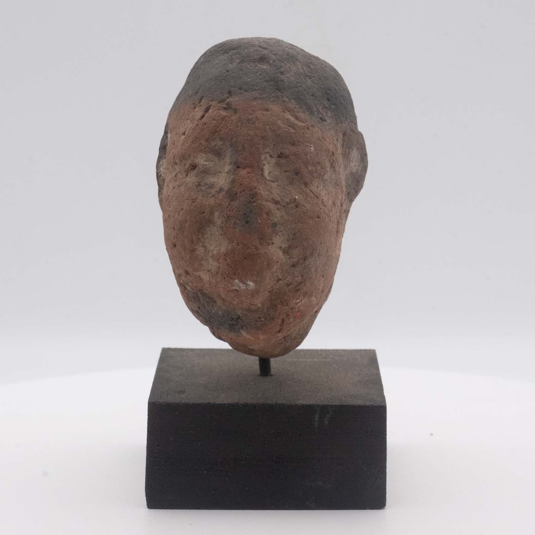 Antique Han Dynasty Chinese Painted Terracotta Male Attendant Head: Medium: Painted Terracotta Size: 2x2.5x3.5 inches Age/Detail: Antique Han Dynasty Chinese Condition: great overall, check photo for condition reference. Fragmentary condition with the original body an