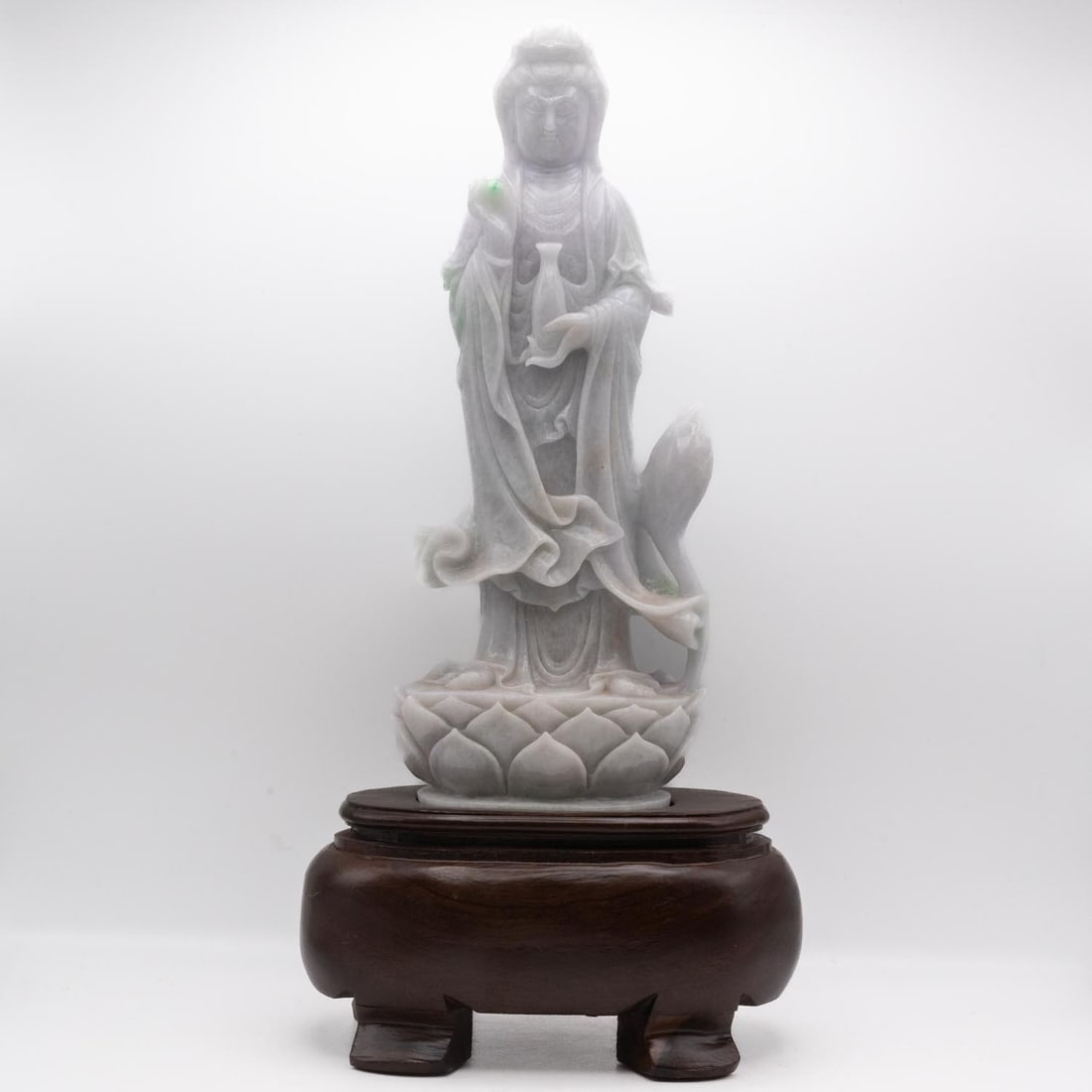 Chinese Hand-Carved Natural Jadeite Guanyin Bodhisattva Figure: Medium: Natural Jadeite Size: 7.5x4.5x16.5 inches Age/Detail: Chinese Hand-Carved Condition: great overall, wood stand missing one leg, check photo for condition reference. Carved from natural jadeite