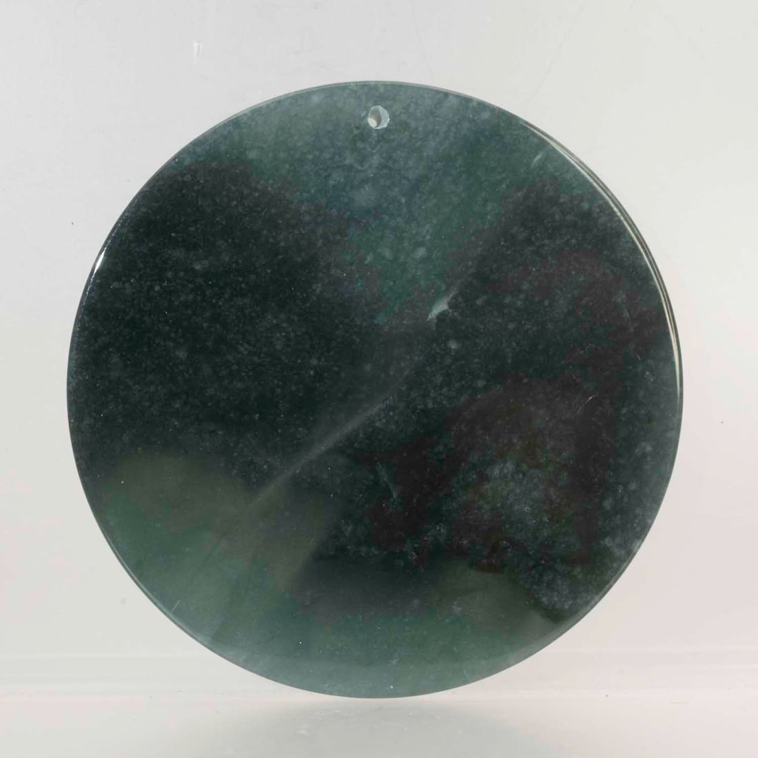 Chinese Carved Natural Dark Green Jadeite Round Pendant: Medium: Natural Dark Green Jadeite Size: 2.2x2.2x0.3 inches Age/Detail: Chinese Carved Condition: great overall, check photo for condition reference. Provenance: Collection from Estate in Williamsburg