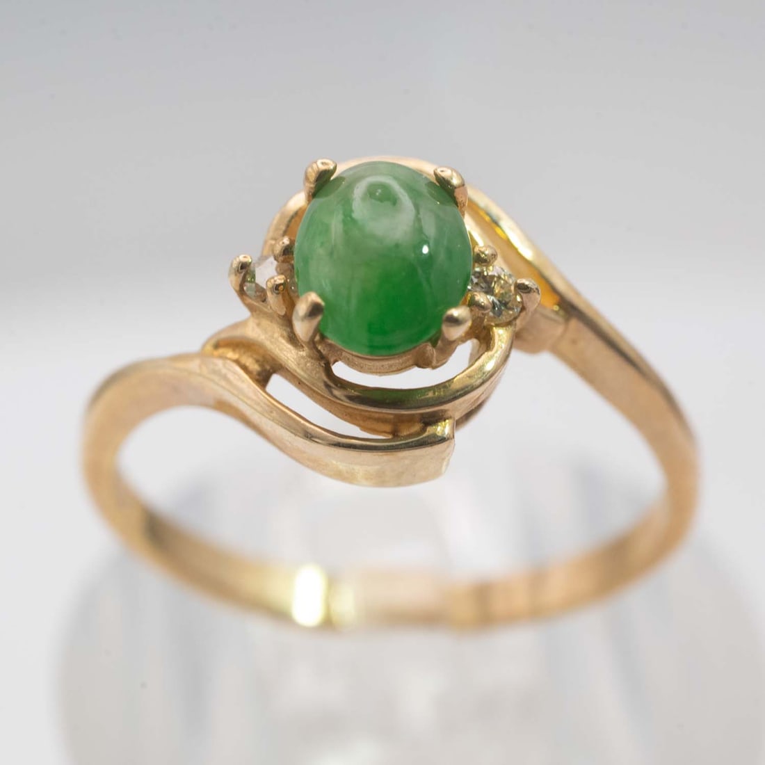 14k Gold Natural Icy Green Jade Cabochon Ring: Medium: Natural Icy Green Jade Cabochon Size: US7,2.72gram Age/Detail: 14k Gold Condition: great overall, check photo for condition reference. Provenance: Collection from Estate in Williamsburg Please