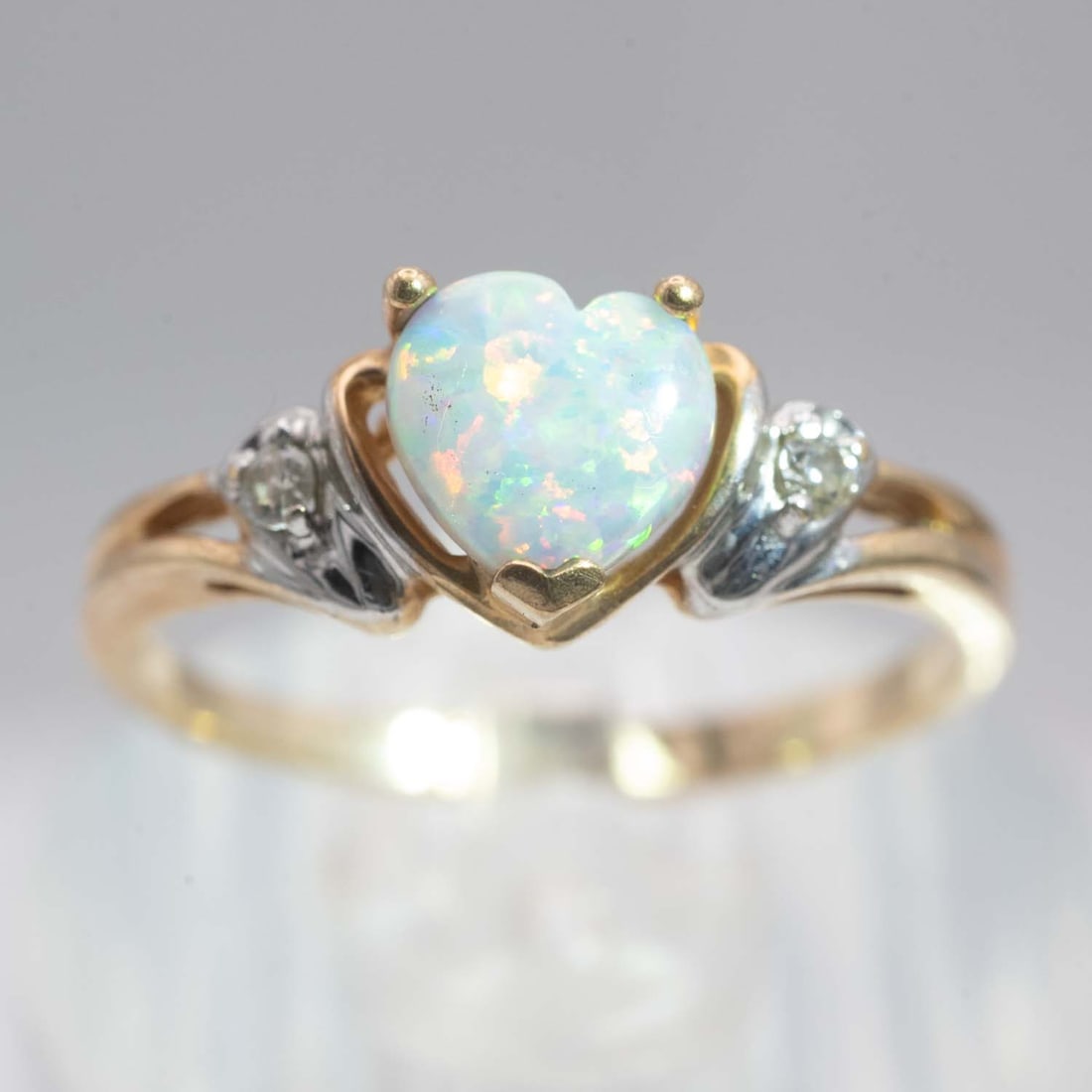 10K Ring Heart Opal And Diamond Ring: Medium: Heart Opal And Diamond Size: US6, 1.68gram Age/Detail: 10K Ring Condition: great overall, check photo for condition reference. Provenance: Collection from Estate in Williamsburg Please view al