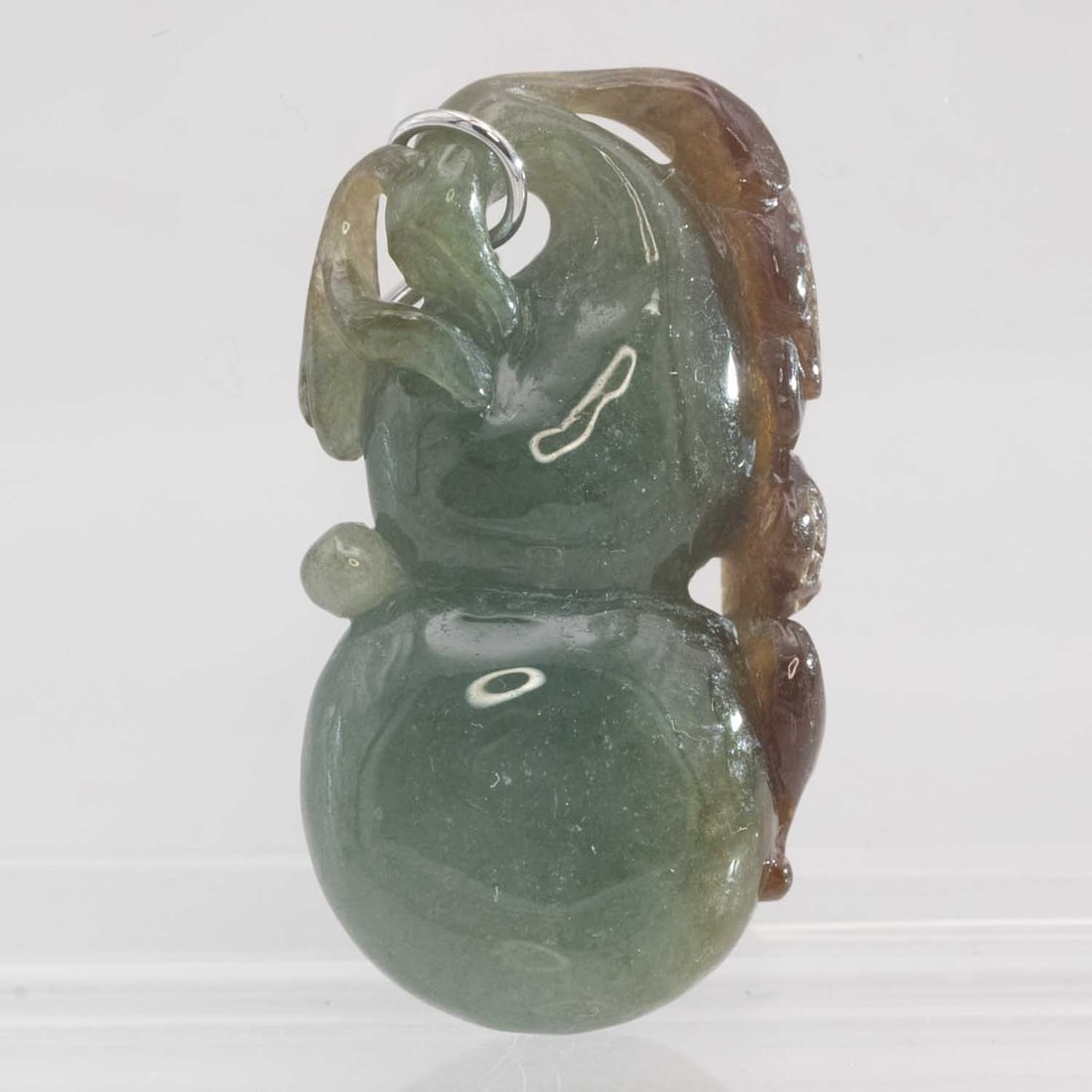 14k White Gold Bail Natural Jadeite Gourd Pendant: Medium: Natural Jadeite Size: 1.5x0.7x0.4 inches Age/Detail: 14k White Gold Bail Condition: great overall, check photo for condition reference. Provenance: Collection from Estate in Williamsburg Pleas