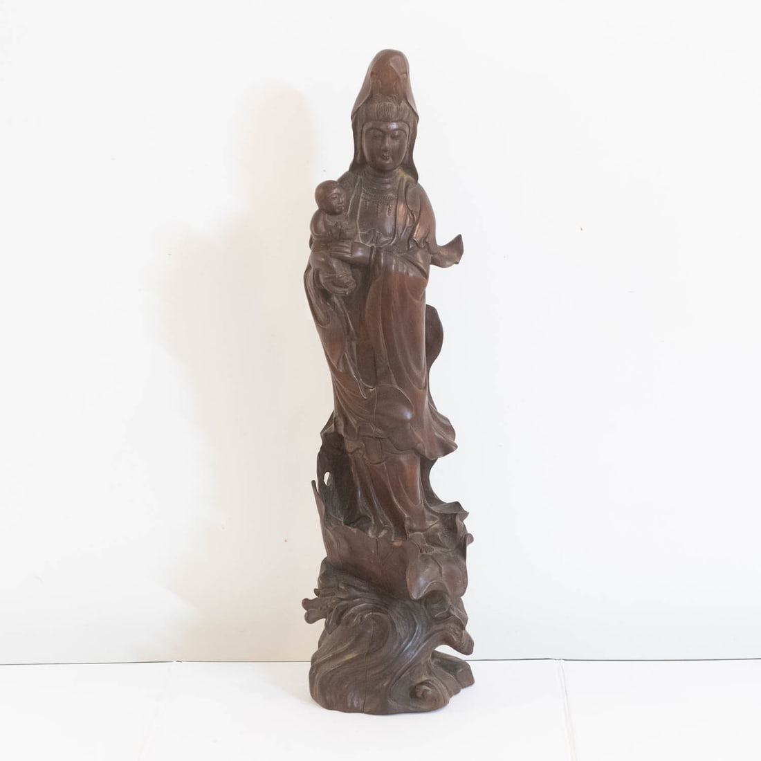 Antique Chinese Carved Wood Guanyin Figure: Medium: Wood Size: 5x4x19 inches Age/Detail: Antique Chinese Carved Condition: great overall, some cracks, check photo for condition reference. Visible age cracks to base consistent with natural wood 