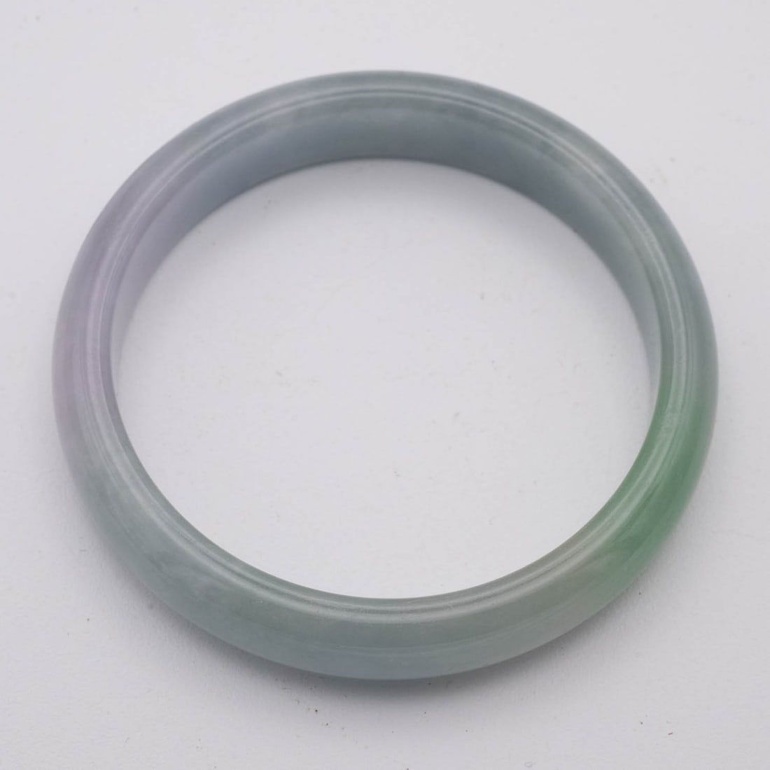 Chinese Lavender And Green Jade Bangle: Medium: Lavender And Green Jade Size: 2.3 inches Age/Detail: Chinese Condition: great overall, check photo for condition reference. Provenance: Collection from Estate in Williamsburg Please view all