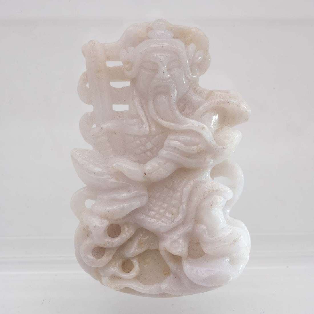 Old Chinese Carved Natural White Jadeite Deity Figure: Medium: Natural White Jadeite Size: 2x1.3x0.4 inches Age/Detail: Old Chinese Carved Condition: great overall, check photo for condition reference. Provenance: Collection from Estate in Tribecca Please