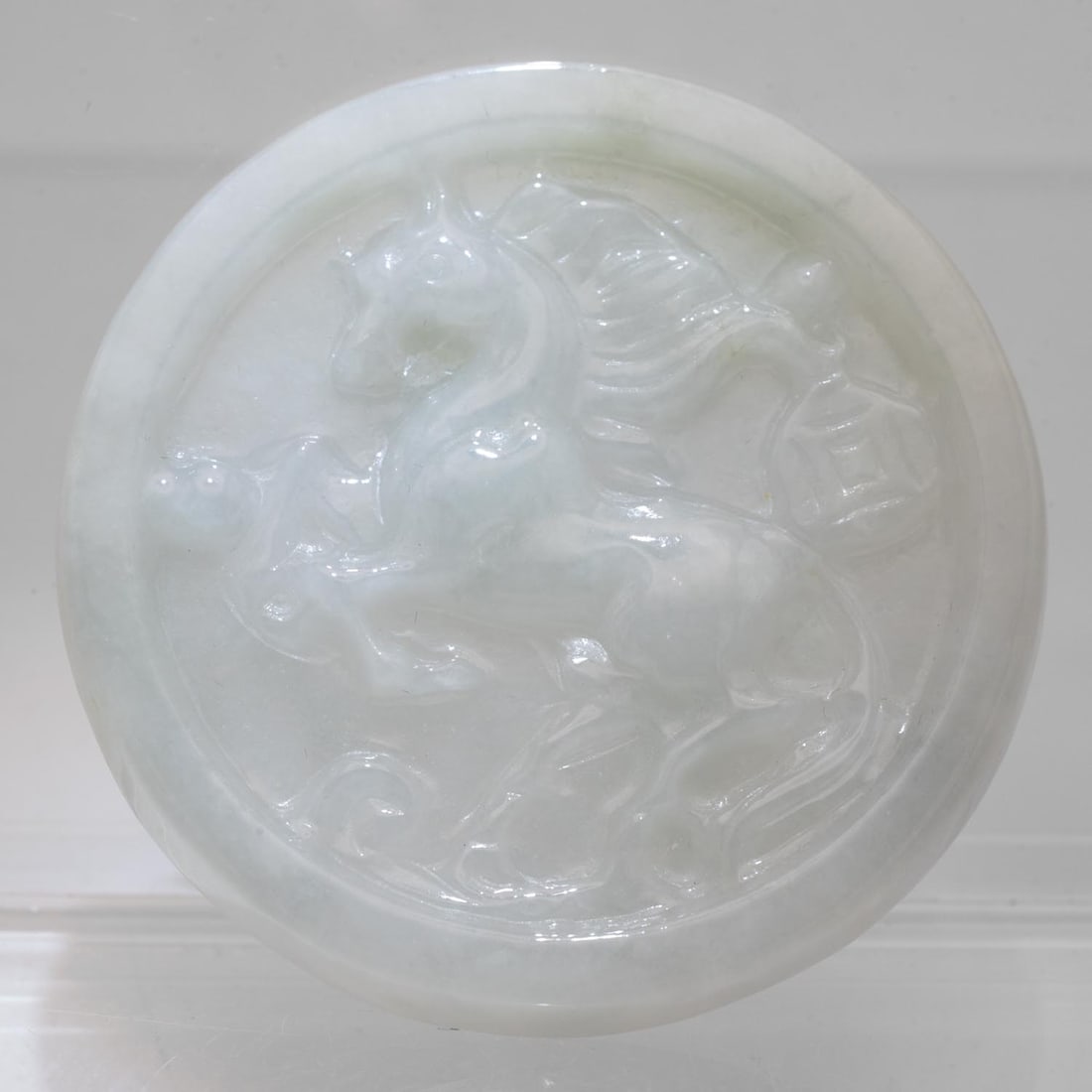 Chinese Carved Jadeite Horse Pendant: Medium: Jadeite Size: 2x2x0.3 inches inner diameter Age/Detail: Chinese Carved Condition: great overall, check photo for condition reference. Provenance: Collection from Estate in Tribecca Please view