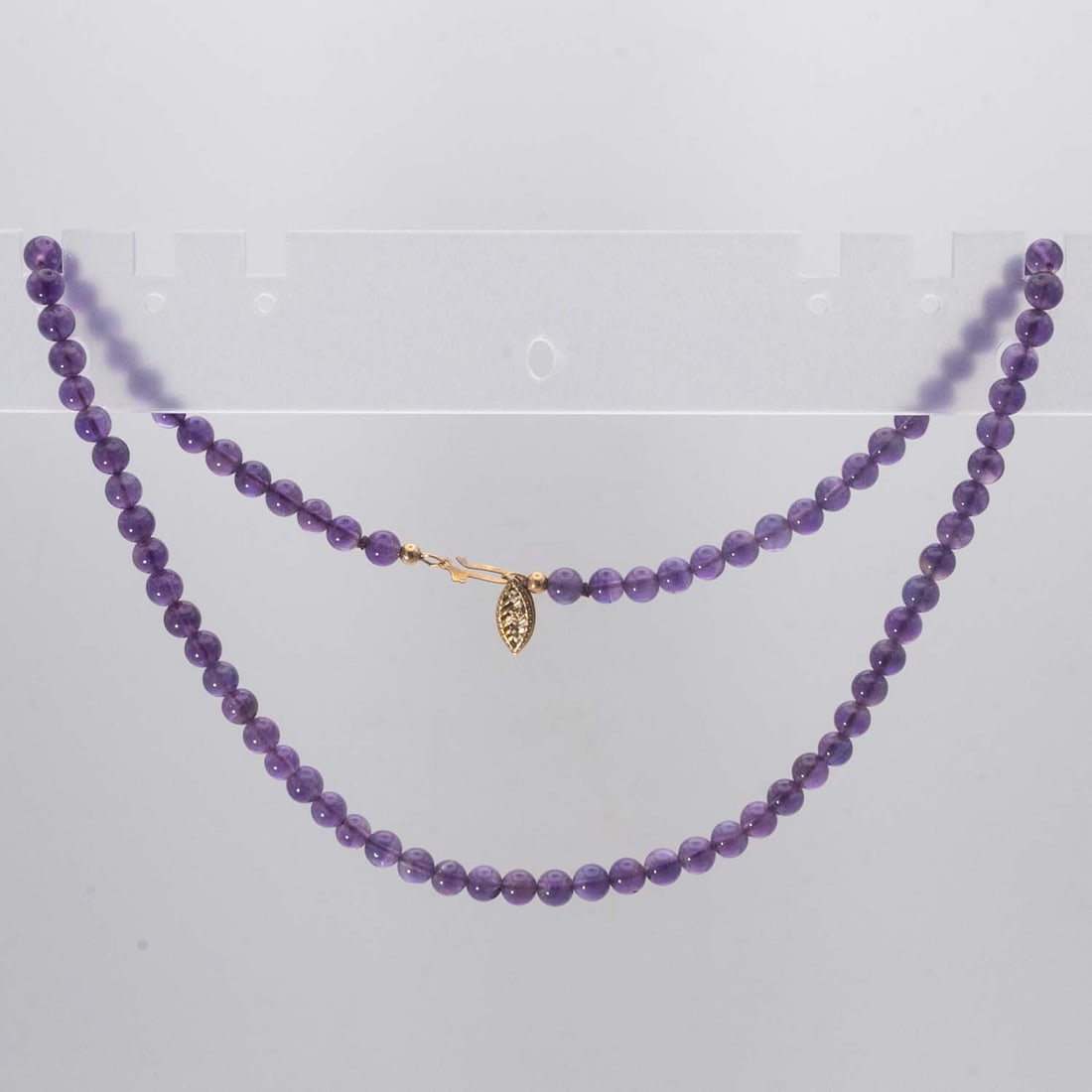 14KGF Amethyst Beaded Necklace: Medium: Amethyst Size: 15 inches long, 0.3x0.3 inches Age/Detail: 14KGF Condition: great overall, check photo for condition reference. Provenance: Collection from Estate in Williamsburg Please view al