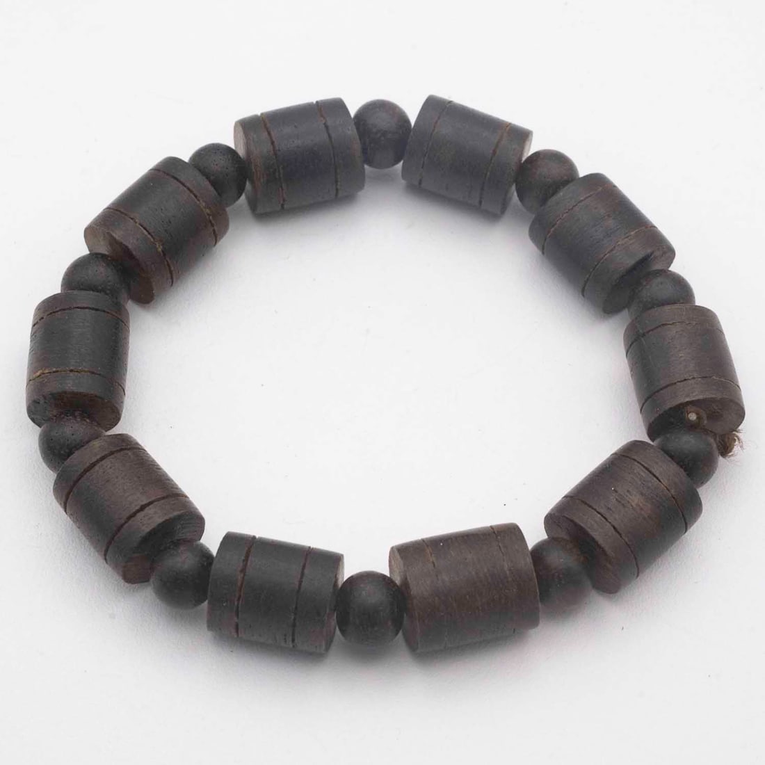 Vintage Chinese Dark Rosewood Barrel Bead Braclet: Medium: Dark Rosewood Size: 0.5x0.6 inches Age/Detail: Vintage Chinese Condition: great overall, check photo for condition reference. Provenance: Collection from Estate in Williamsburg Please view all