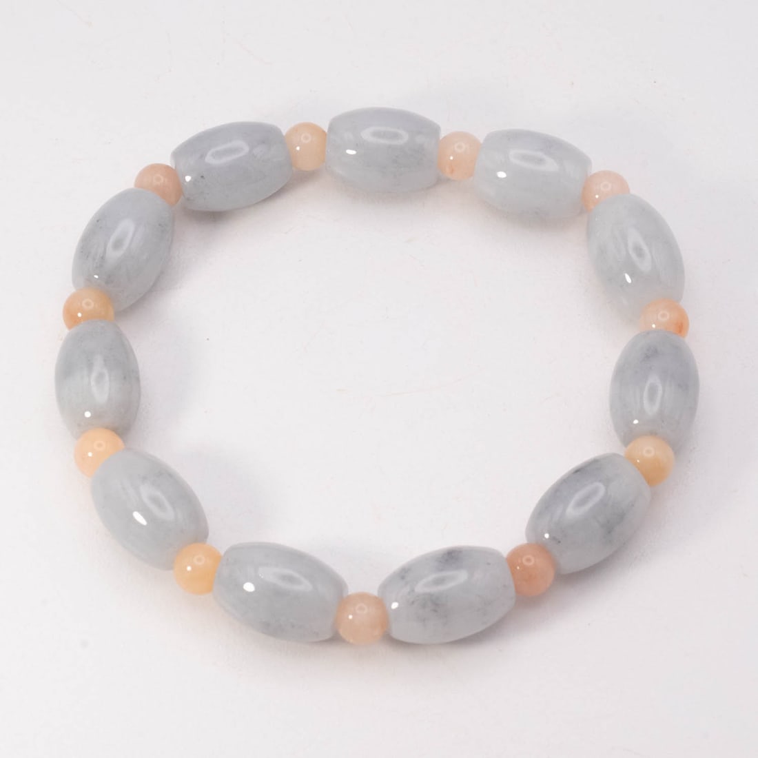Chinese Natural Gray Jadeite Bead Bracelet: Medium: Natural Gray Jadeite Size: 10x14 mm Age/Detail: Chinese Condition: great overall, check photo for condition reference. Provenance: Please view all the photos as they are part of the condition