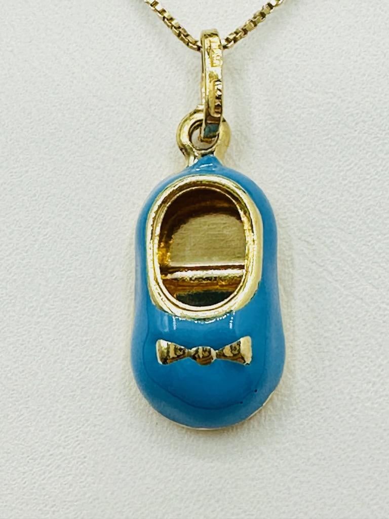 14KT Yellow Gold Lovely Baby Shoe Enamel Pendant and Chain # 2163: # 2163 14KT Yellow Gold Lovely Baby Shoe Enamel Pendant and Chain 18” chain with spring ring clasp closure Pendant and Chain Weight: 2.60 grams Pendant size: 25 mm x 9.50 mm