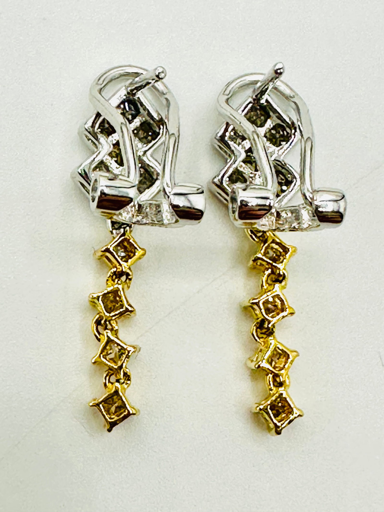 Pair of Natural Diamond Earrings, 18KT White and Yellow Gold # 2313: # 2313 Pair of Natural Diamond Earrings, 18KT White and Yellow Gold 22 pieces princess diamond 0.60 carat(t.w.) French clip Earrings Weight: 3.70 grams Earrings Size: 23.50 mm X 6.5 mm