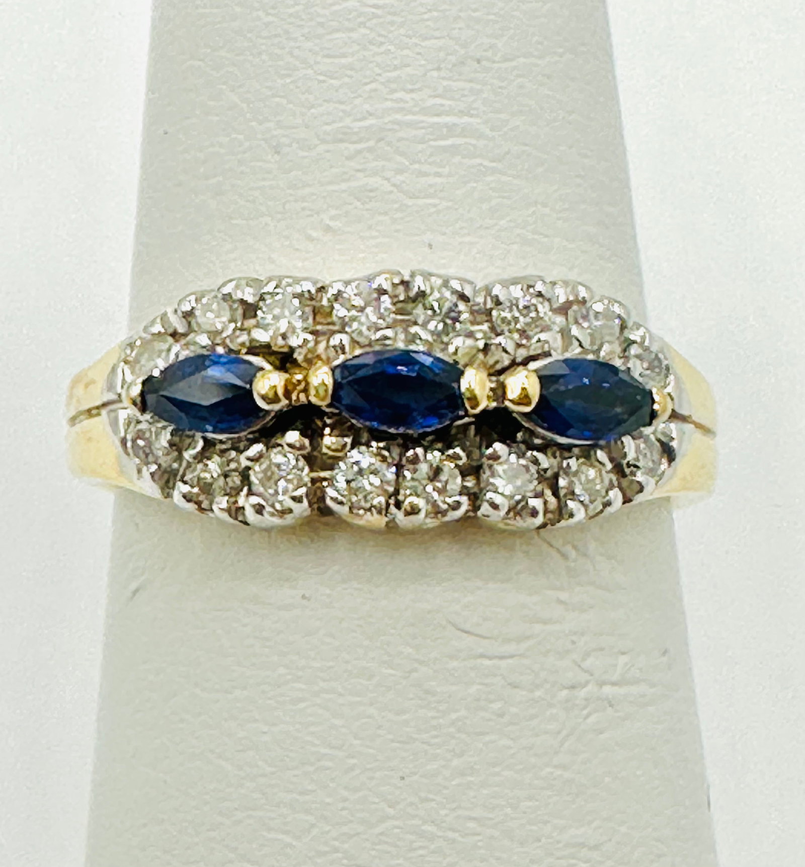 14KT Yellow Gold,Natural Diamond and Sapphire Ring # 2689: # 2689 14KT Yellow Gold,Natural Diamond and Sapphire Ring 16 pieces diamond 0.28 carat(t.w.) 3 pieces marquis sapphire 0.25 carat(t.w.) Ring Weight: 4.00 grams(t.w.) Size 6