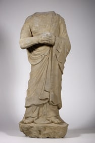 A Headless Stone Buddha Statue
