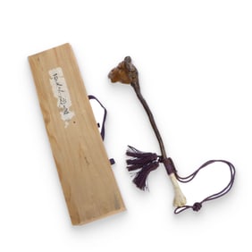 A Chinese wooden ruyi ornament