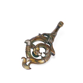 A copper hook inlaid with gold and silver