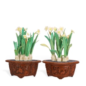 A pair of Chinese red-lacquered ornaments