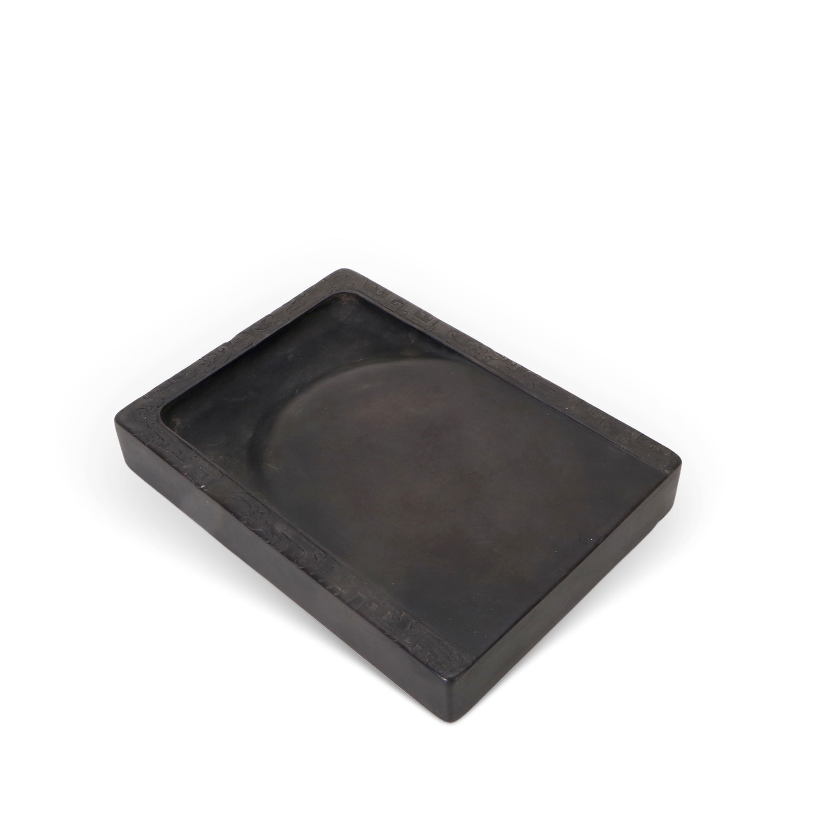 A Duan stone inkstone: An inkstone, with carved patterns around the edges. L:19cm H:3 cm W:13.8 cm