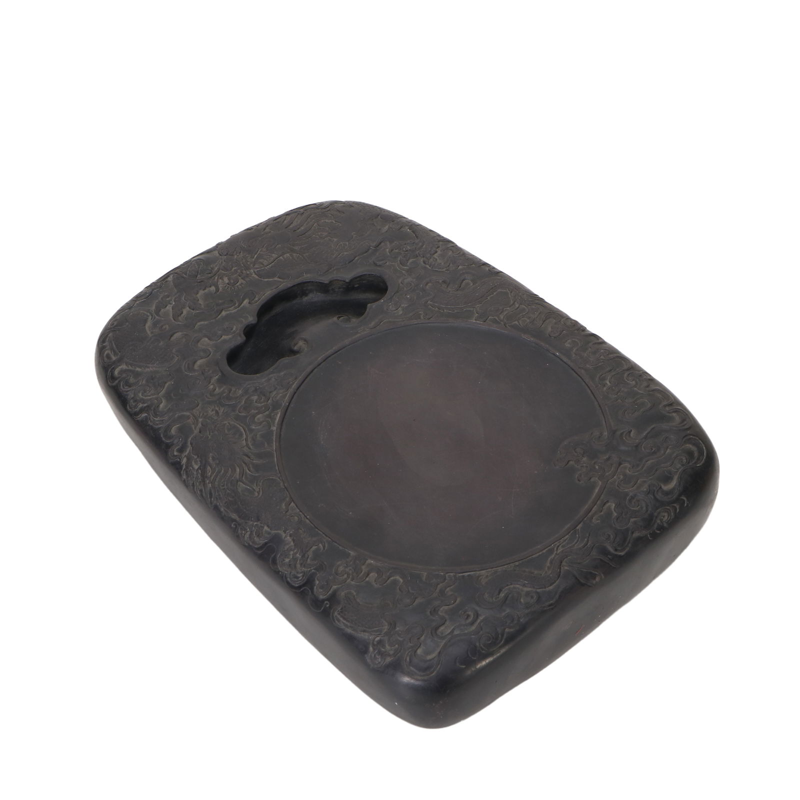 A Duan stone inkstone: A inkstone, except for the center, is carved with dragon and cloud patterns all over.L:29.5cm H:5.6 cm W:21.5 cm