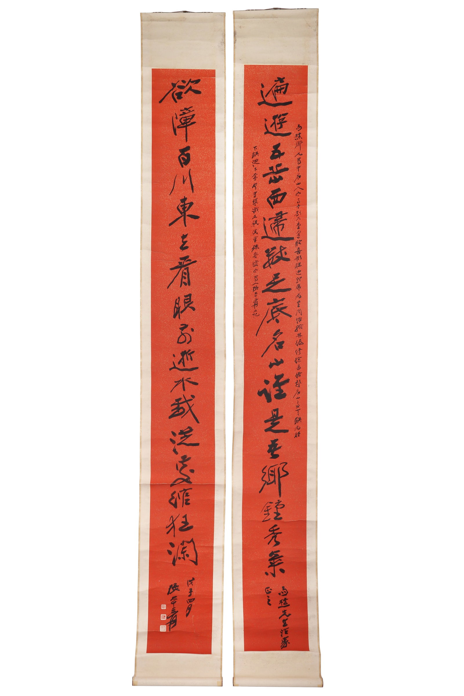 A Chinese Calligraphy Couplet, Signed by Zhang Daqian: A Chinese calligraphy couplet, signed by Zhang Daqian, featuring three seals. written in ink on red paper with golden spots. Hanging scroll. H: 238cm W: 26cm X2 (painting)