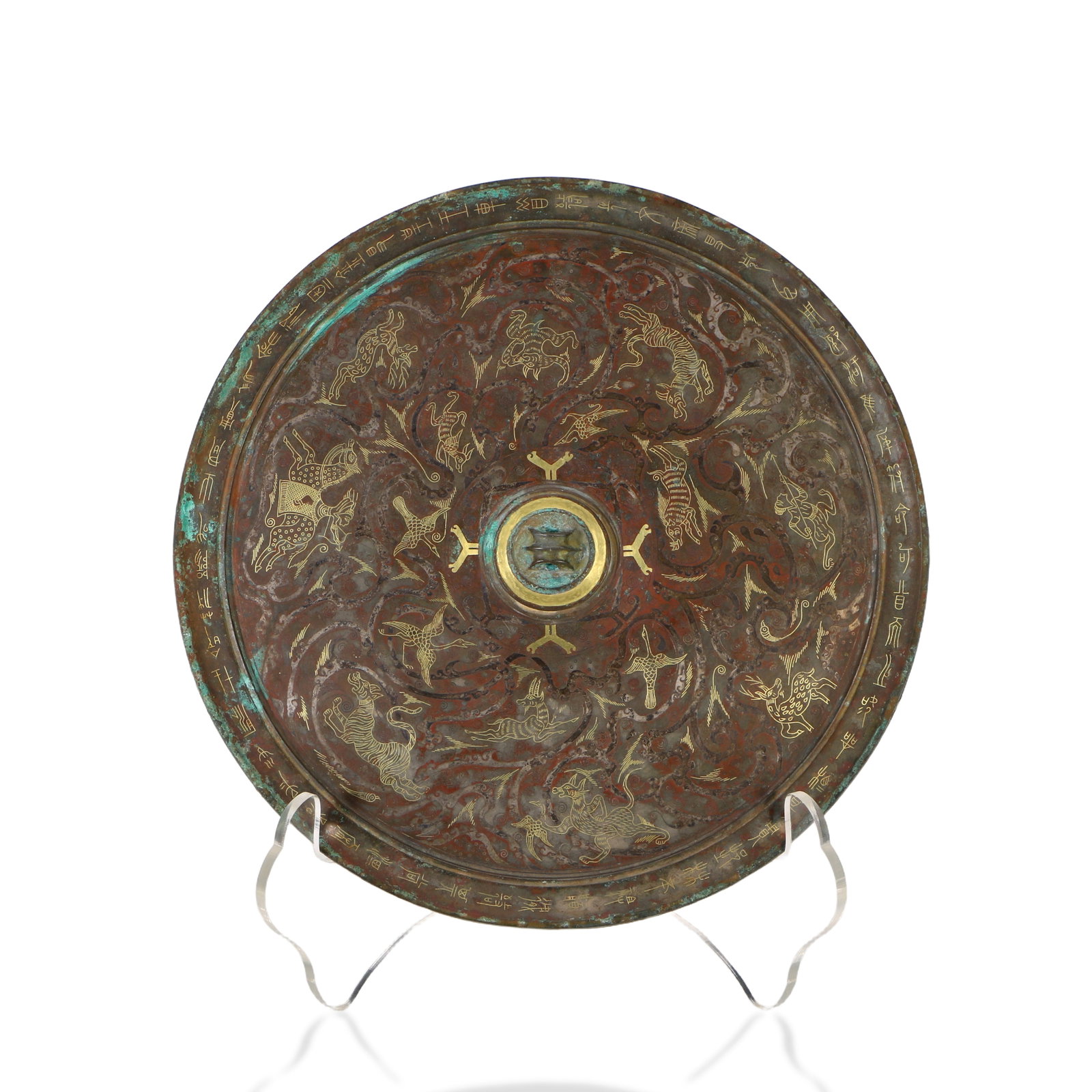 A bronze mirror inlaid with gold and silver: The central image depicts a hunting scene, with a diameter of 26 cm.