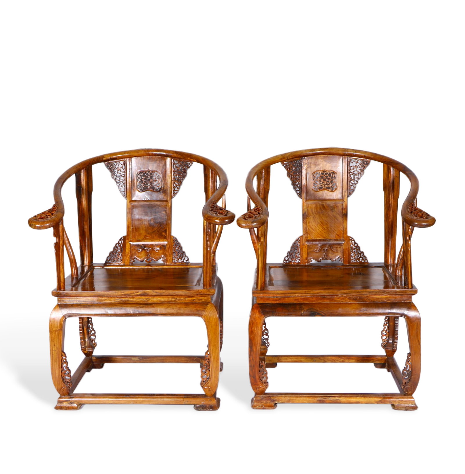 A pair of huanghuali chairs: The armrests, backrest, and base all have some hollow carvings. Height 99 cm, width 53 cm, length 73 cm.