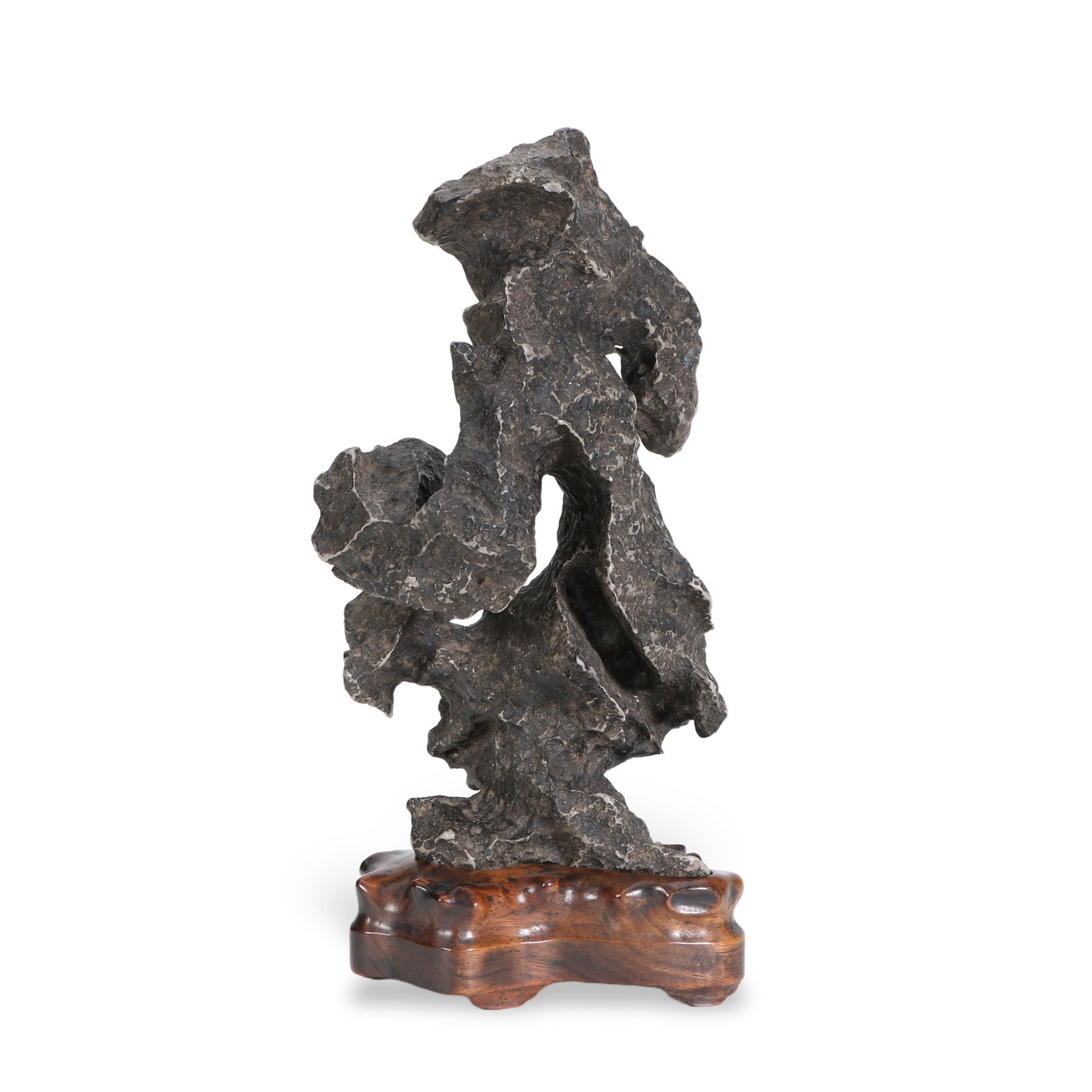 A Qing Dynasty Lingbi stone ornament: The stone has an irregular shape, with a suitable base at the bottom. Height 28cm, length 13cm, width 11.5cm.