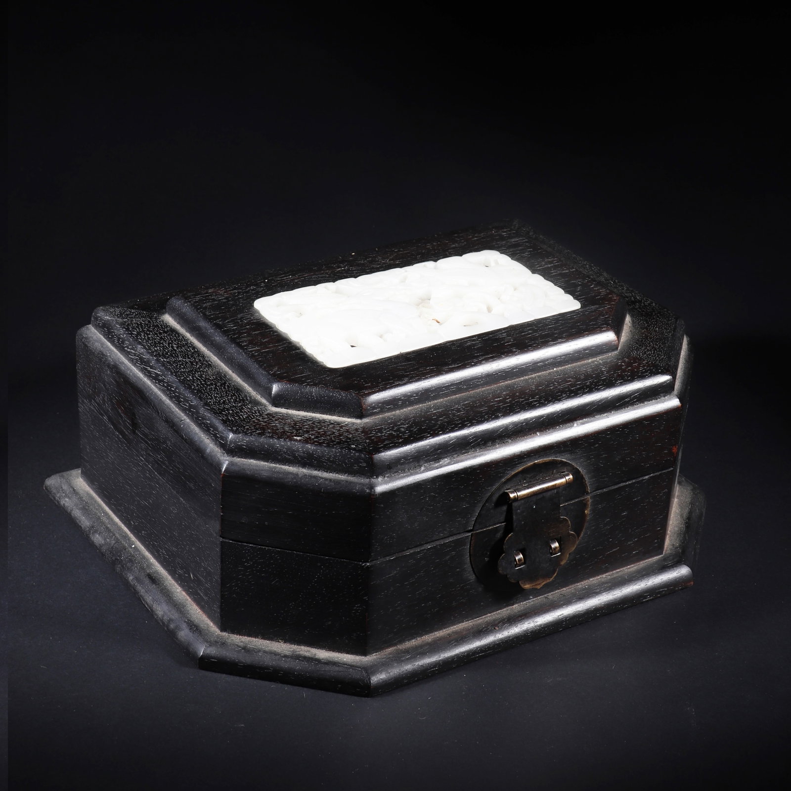 A Chinese Style Jewelry Box: A Chinese style jewelry box, the material is rosewood, which can be opened, and the lid is embedded with hollowed out carved white jade. H: 10cm L: 20cm W: 16.5cm (Max)