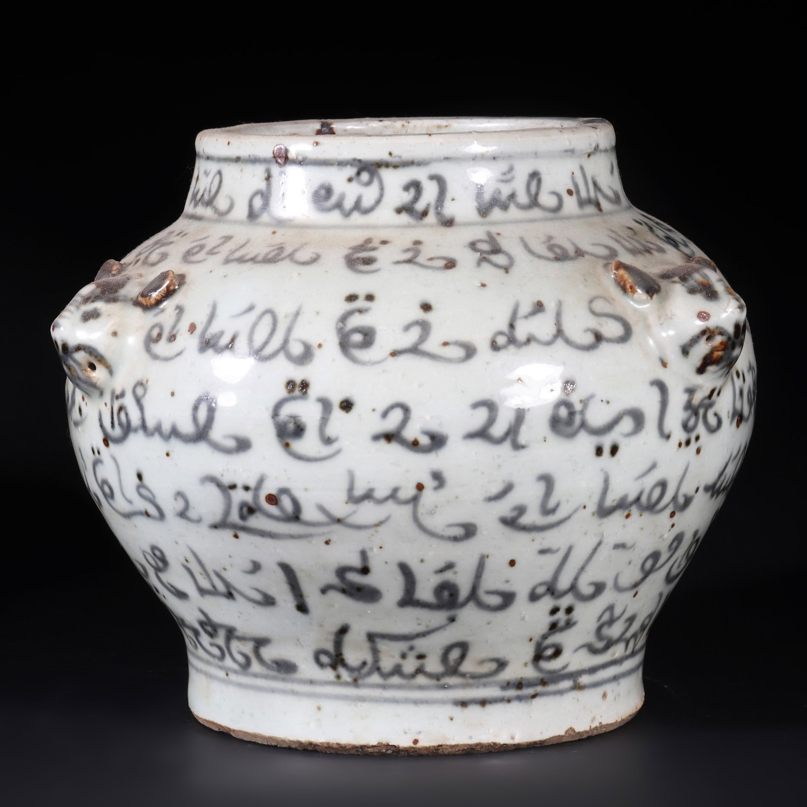 A Porcelain Jar: A porcelain jar with some black texture on the body and three mouse shaped ears. H: 14.5cm D: 16cm (Max)