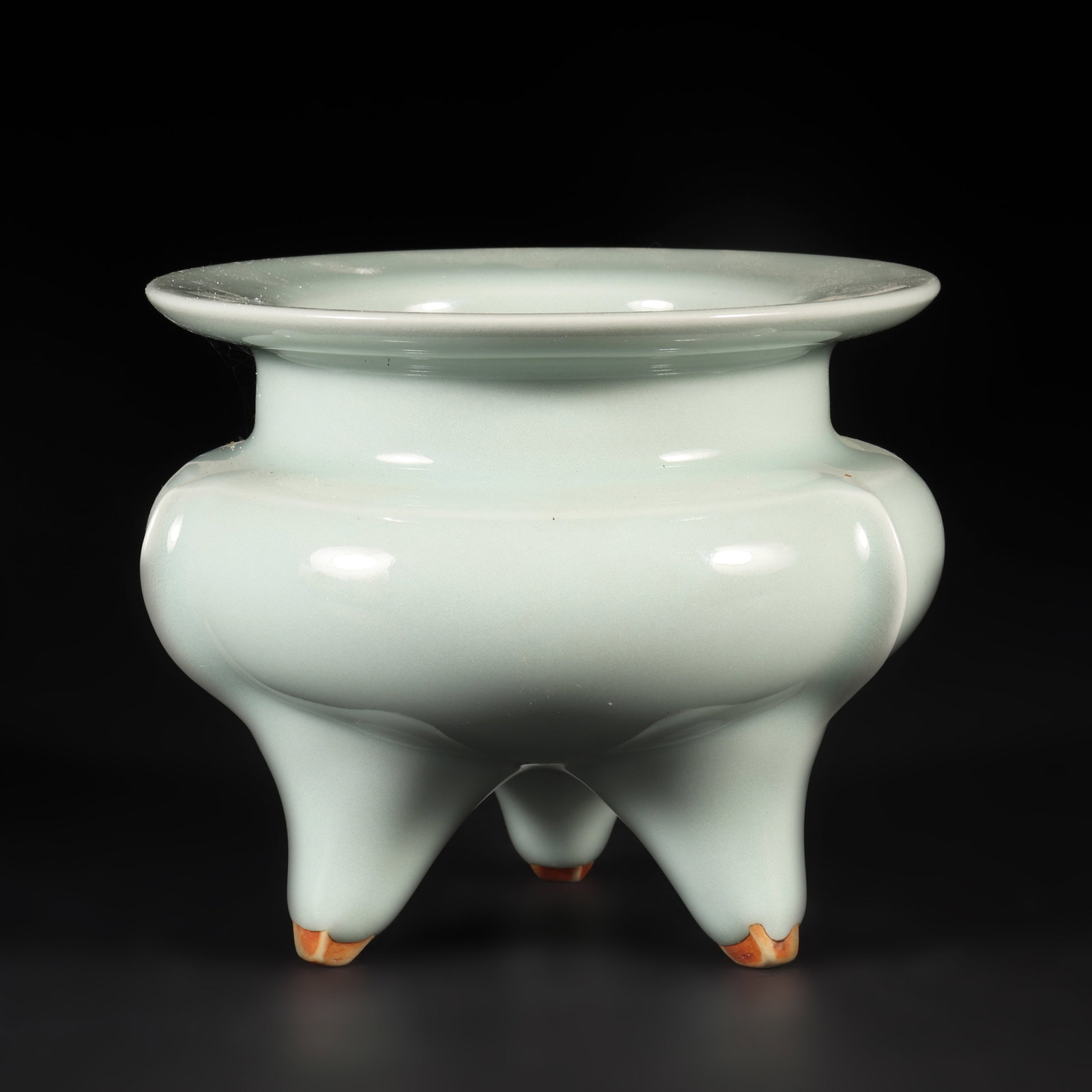 A Longquan Kiln Blue Glazed Incense Burner: A Longquan kiln blue glazed incense burner with a ribbed body and three legs. H: 10cm W: 12cm (Max)