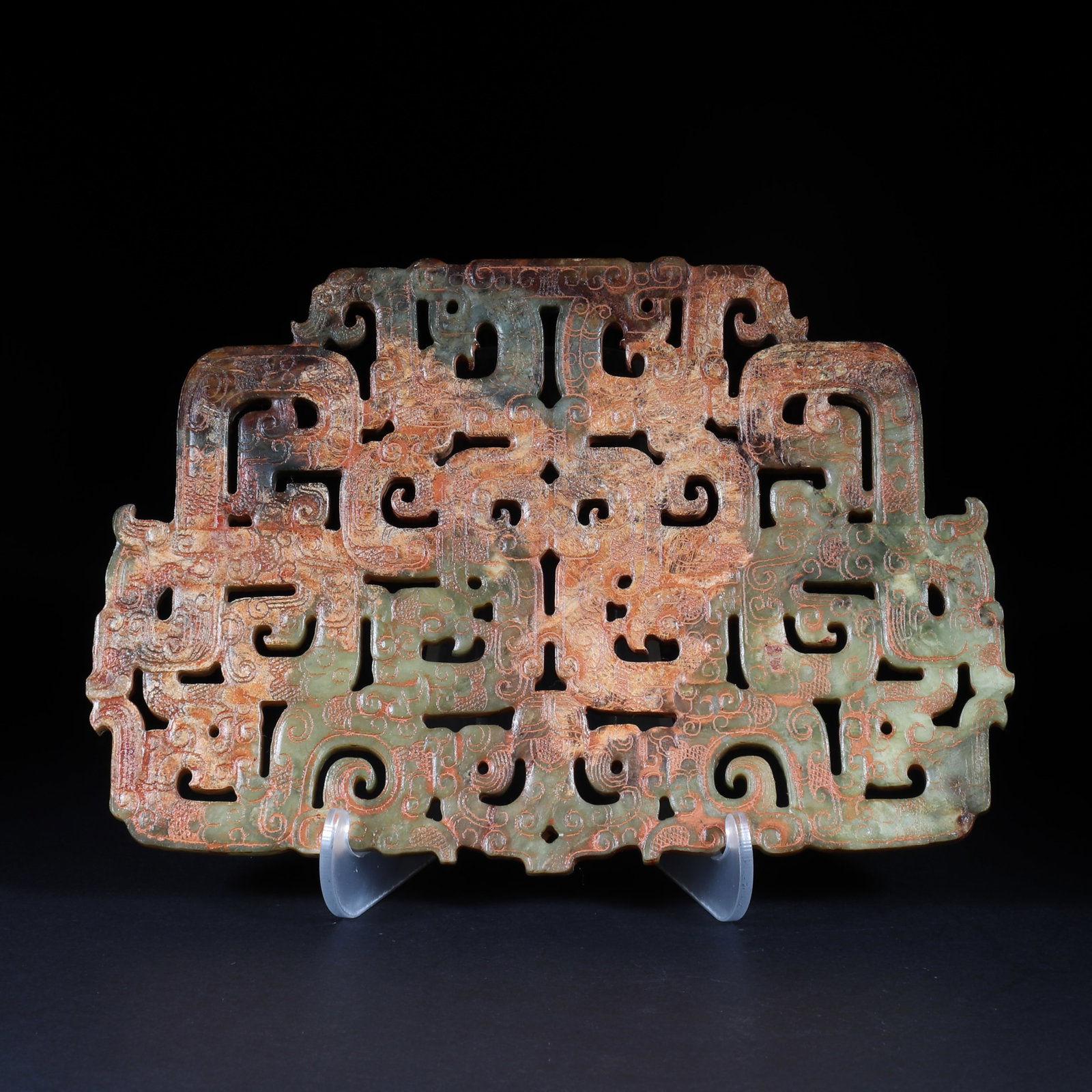 An Ancient Jade Bi: An ancient jade bi, carved with various dragon and phoenix patterns as a whole. H: 12cm W: 17.5cm (Max)