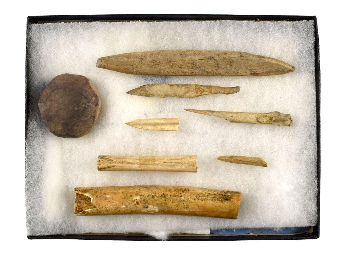 Fort Ancient Bone Display: Assortment of Bone tools from the Goldcamp site in Lawrence Co., Ohio. Ex - Lincoln Smith Collection. Includes a stone Discoidal or bottle lid.