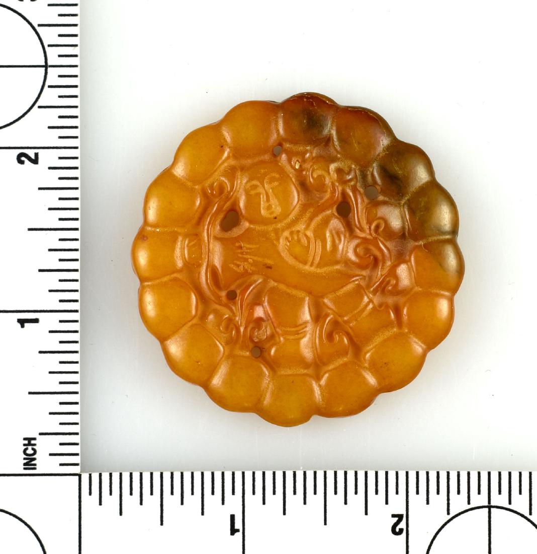 2" Chinese Pendant: Yellowish stone example featuring an ancestral figure in the center. Exact age unknown.