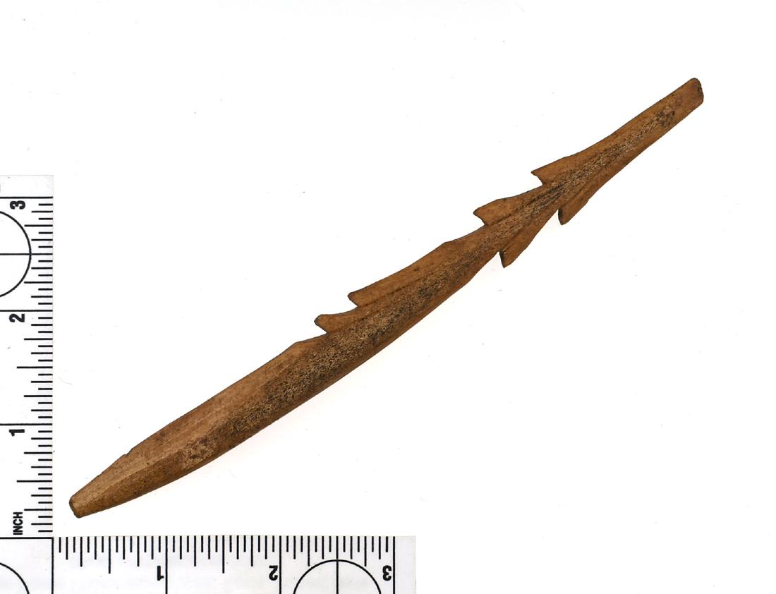 6 3/4" Inuit Bone Harpoon: Barbed example with detailed grooving. Point Hope, Alaska. Ex Lincoln Smith Collection.
