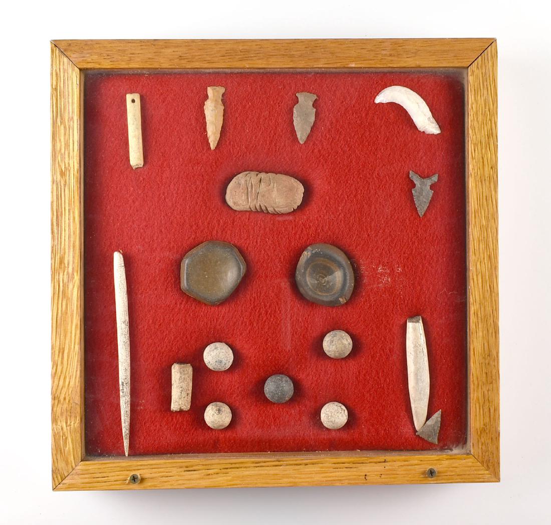 12x12 Display of TN Bone and Stone Artifacts: Bone Tools, Marbles, and a tallied stone in this wooden display from the Howard Griffin Collection.