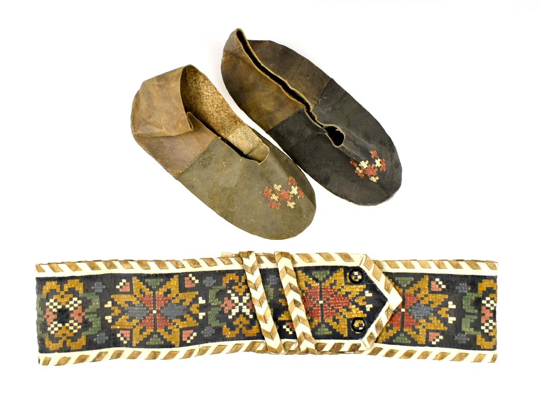 31" Inuit Child's Sash and Booties: Interesting group from the Early to Mid 20th Century stitched in natural and dyed sealskin with a cloth backing.
