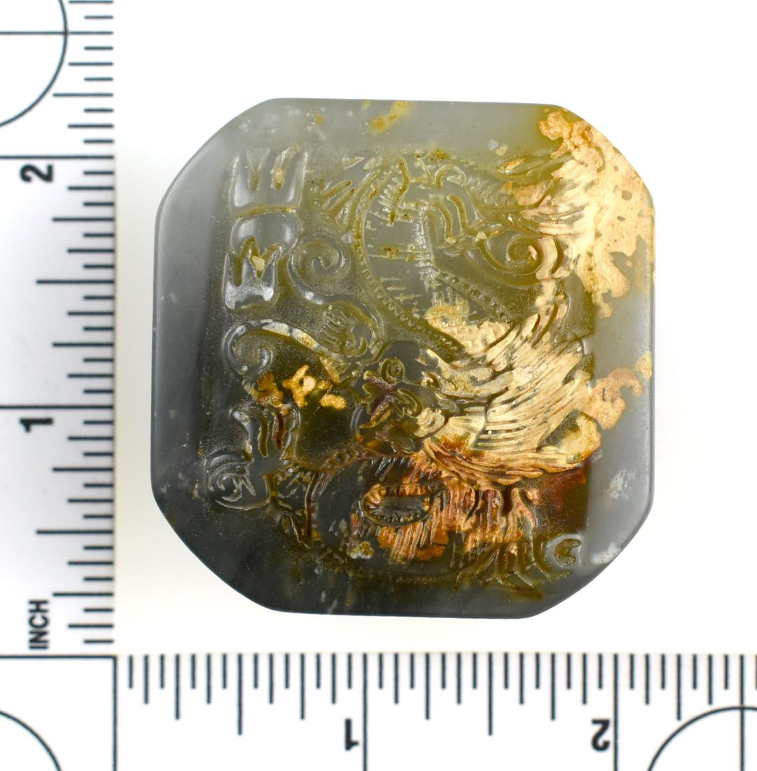 Fine Chinese Green Jade Stamp: Intricated carved on top with Phoenix and Dragon. Translucent. Four character mark stamp. 1 13/16" x 1 3/4" wide x 3/4" thick. Weighs a substantial 106 grams.