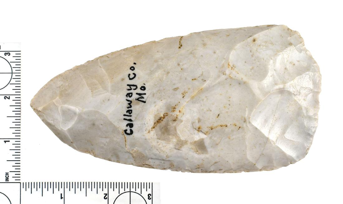Fine 6 1/2" Flint Hoe: Expertly crafted glossy white Burlington chert example. Great bit polish. Found in Callaway Co., Missouri. Ex- Sam Johnson and Cowan Hood Collections.