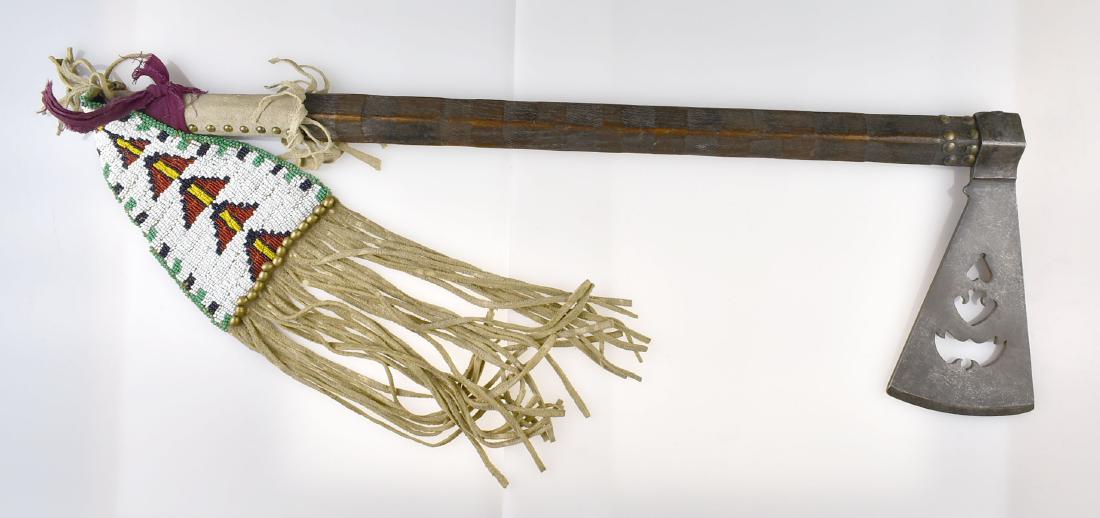 24" Replica Tomahawk Axe with Drop: With Bat, Heart, and Bird cutouts. Beaded brain-tanned drop extends an additional 16" below the piece. Excellent for display or decoration. File-branded handle.