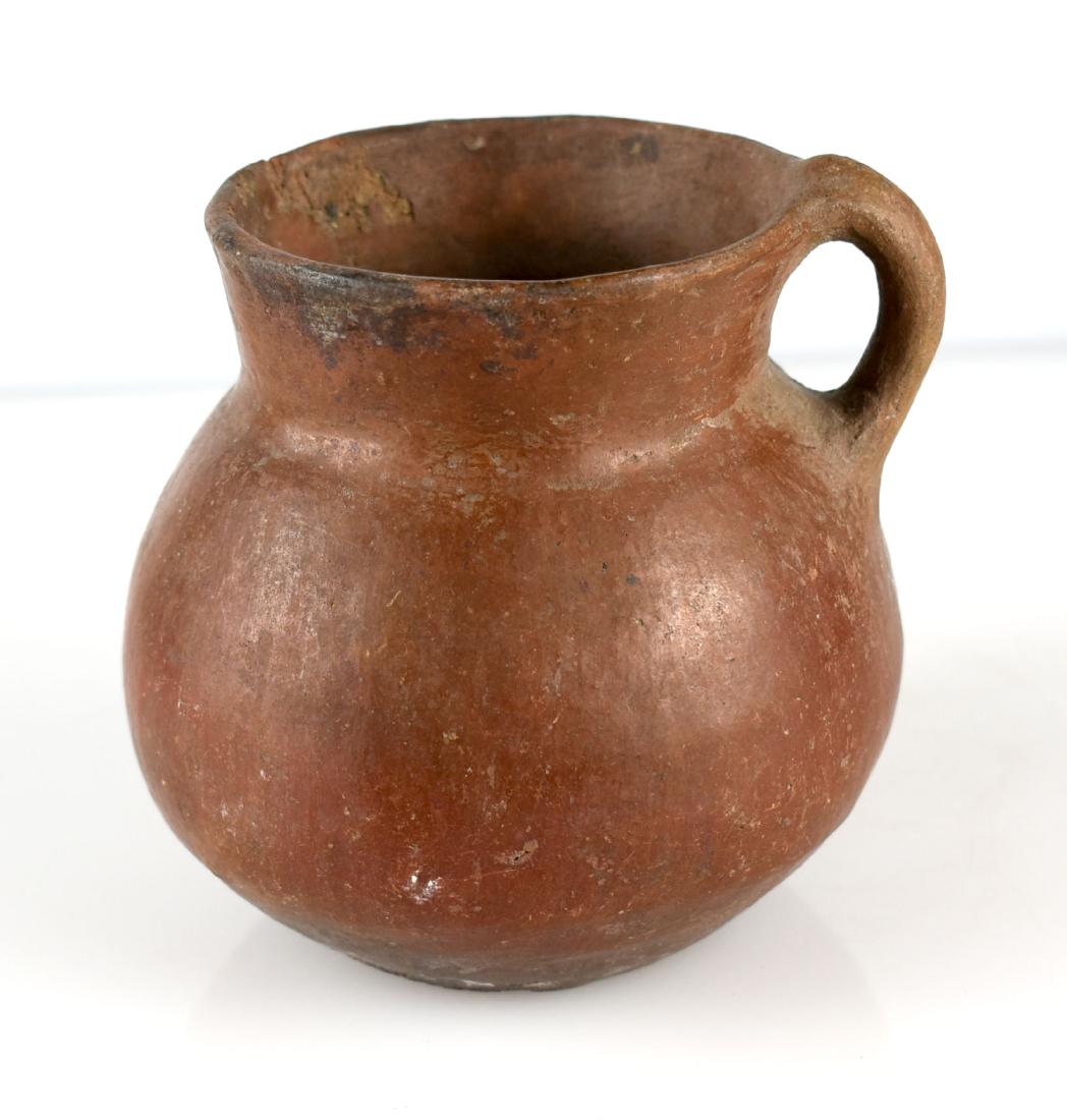 4 1/2" South American Pottery Jug: Single handled redware glazed jug consigned by a Kentucky Collection.