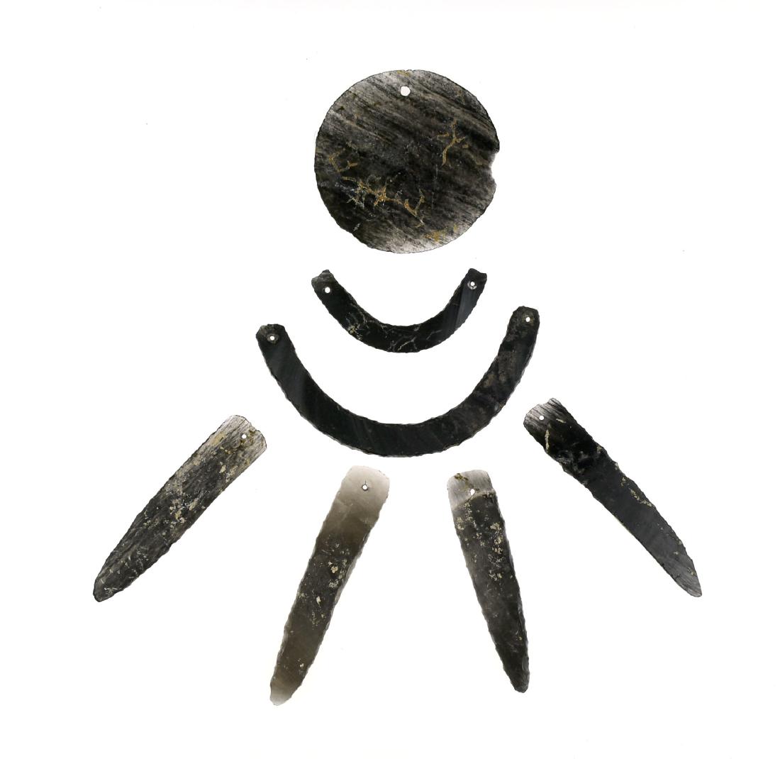 7 Mixtec Obsidian Gorgets/Pendants: Assortment of 4 Pendants, 2 Gorgets, and one Sun/Moon Pendant. From a Private California Collection.