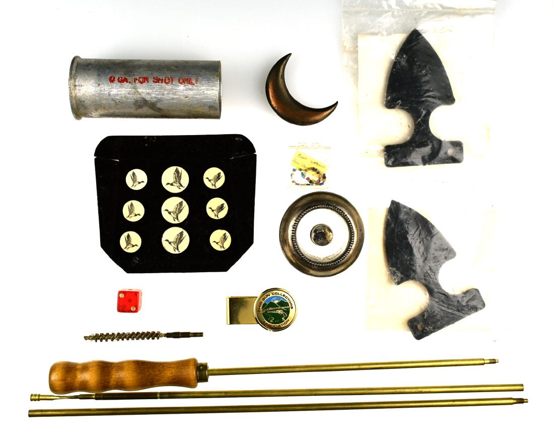 Assorted Manly Items.: Gun cleaning rod, 0 Gauge shell, Duck themed jacket buttons, Ohio GuN Collector's association money clip, and two fiberglass self defense daggers. Sterling Silver Cigar lighter, and more!