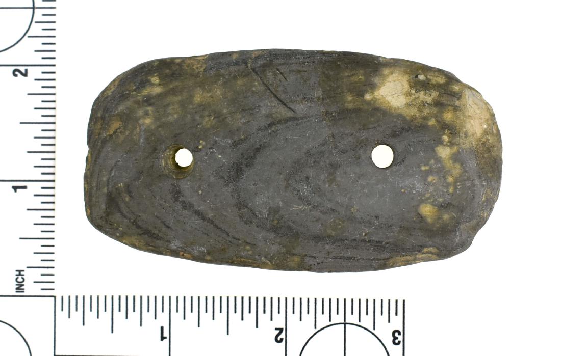 3 1/2"Adena Gorget: Excellent uncleaned example loaded with original mineralization. Banded slate. Darke Co., Ohio. Ex Frank Adell Collection.