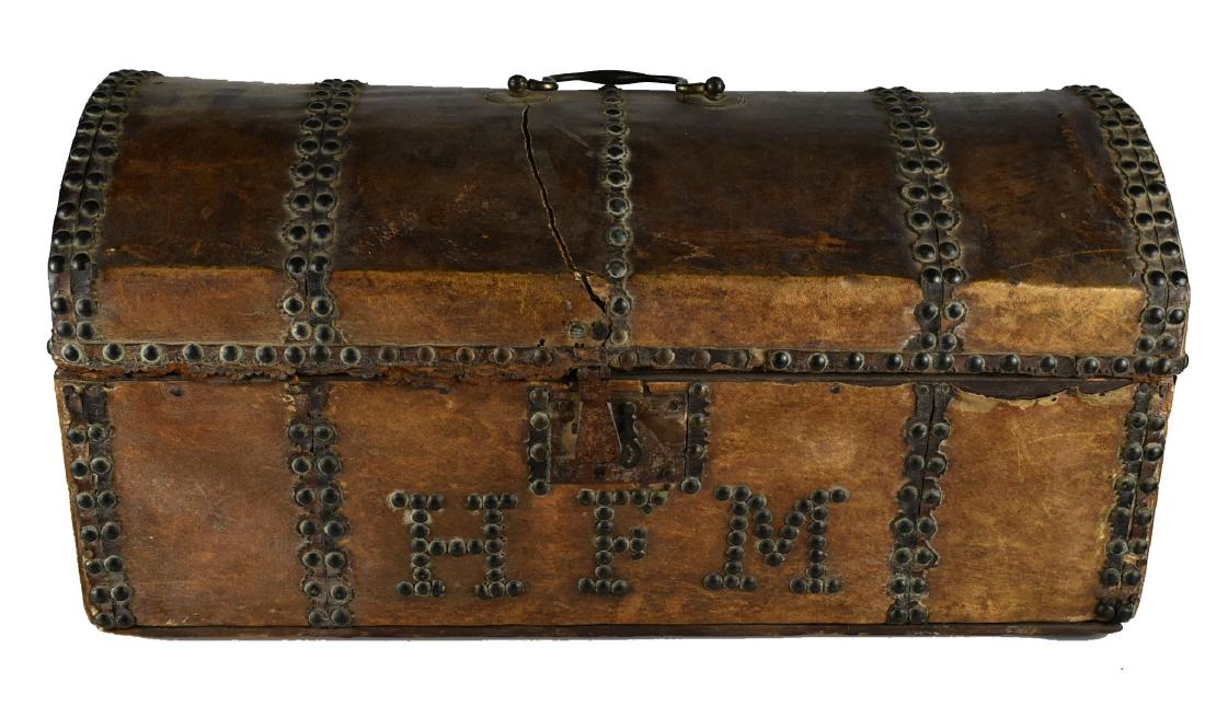 18th Century Leather Chest: 20x9.5x10" example with brass tacks and leather-perhaps buckskin wrap. Initials HFM on front with 18th century lock. Highly unusual item!