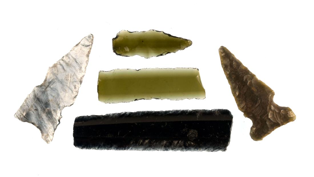 5 pc. Assemblege of Obsidian Tools: Pre-Columbian. West Mexico. ca. A.D. 1-500. 3 arrowheads. 2 bladelets. Biggest measures just over 2 inches. All translucent.