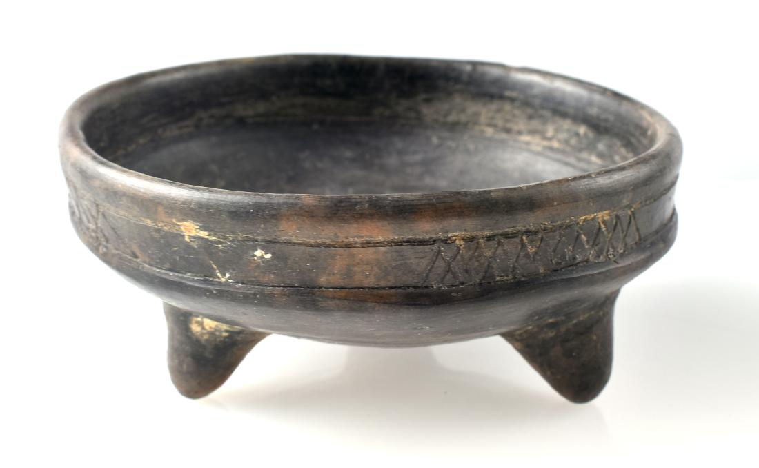 6 1/4" PreColumbian Mayan Tripod Bowl: Monochrome glazed bowl with engraved featured. Ex California Private estate. Good root tracks and other indicators of antiquity.