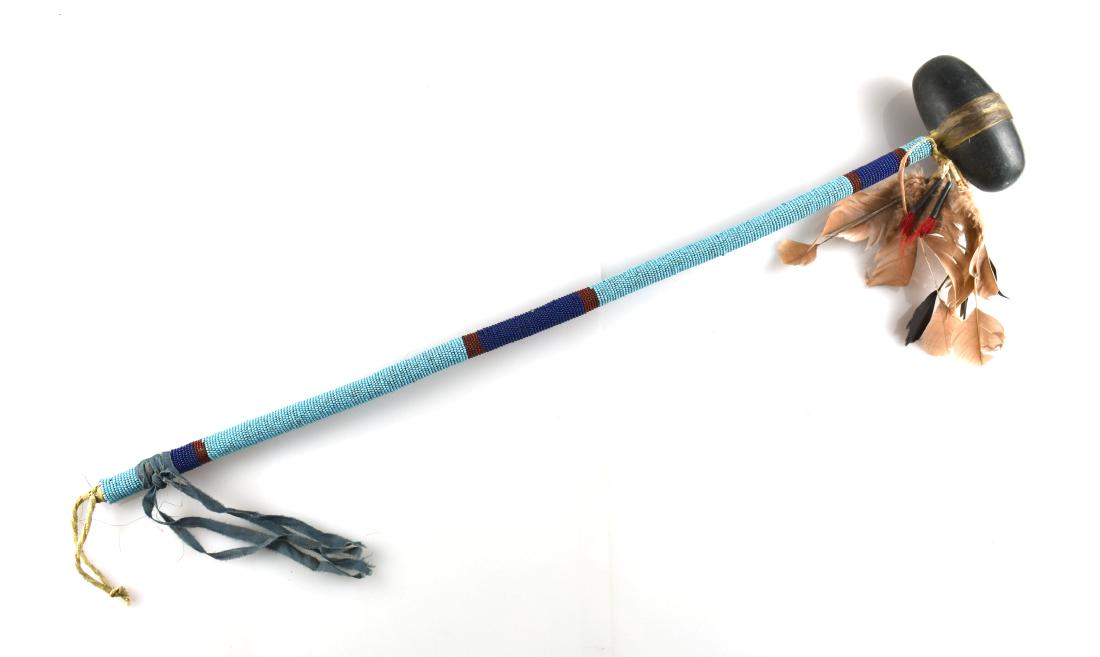 30-1/2" Decorative Plains War Club: Tourist trade items with dyed turkey feathers and more recent beadwork. Probably a post-WW2 example.