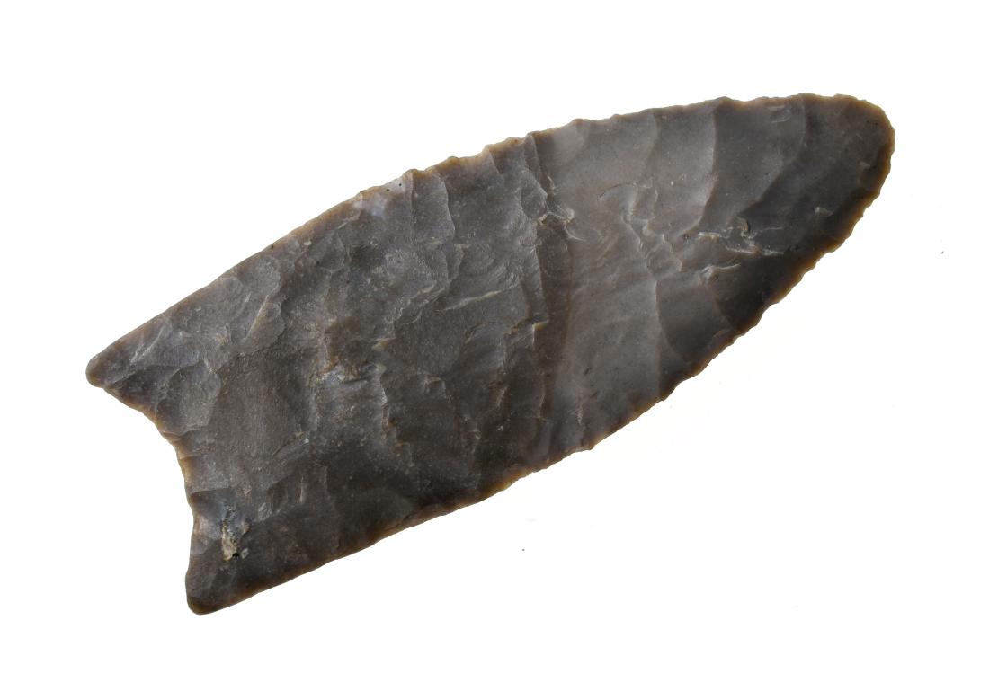 Superb 2 3/4" Kansas Clovis: Nice gray fossil chert example from Riley Co., Kansas. Very thin unfluted example with good basal thinning. Made of classic Winterset Chert.