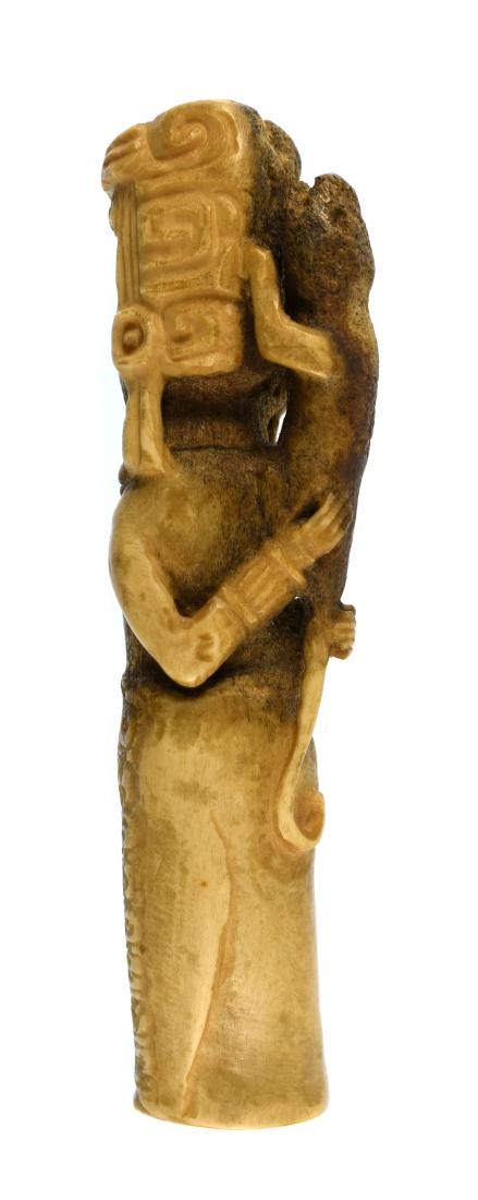 4 7/8" Ancient Mayan Carved Bone Idol: Pre-Columbian. Mayan Territories, Classic Period, ca. A.D. 250-900. Very rare. Central figure standing with lizard on its back with detailed features and glyphs. Compare to Skinner's American Indian &