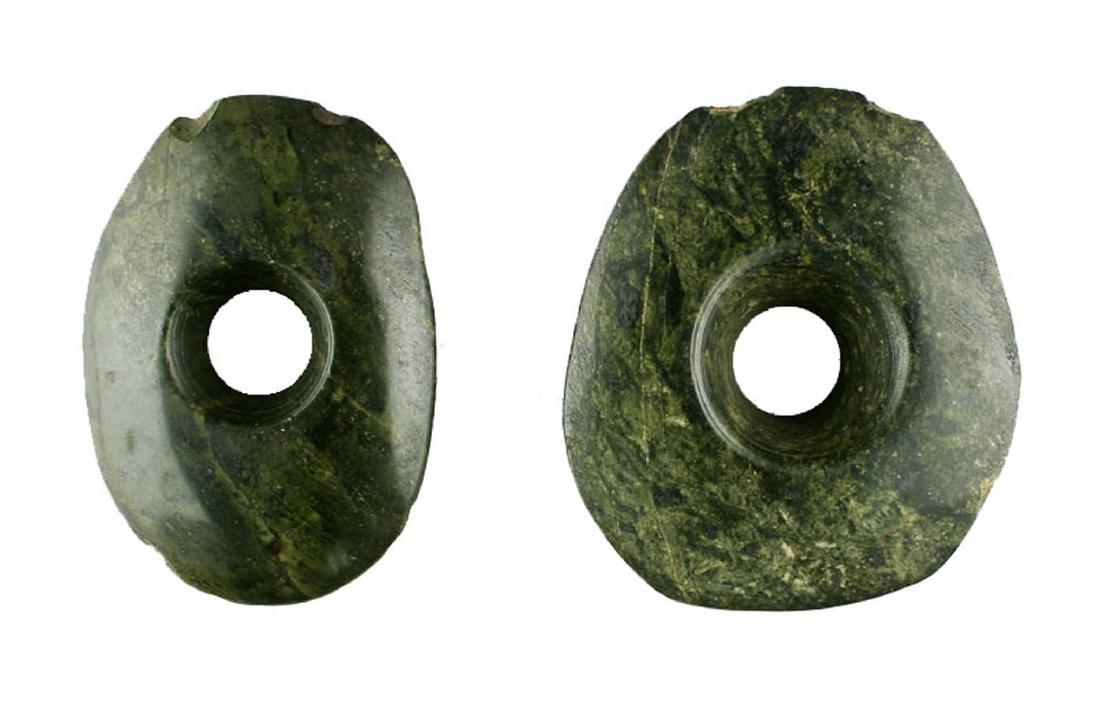 Large Pair of Ancient Mayan Ear Spools: Pre-Columbian. Mayan Territories. ca. 250-900 A.D. Unusually large matched Mayan ear spools. Great form, size, and color. Made of highly polished dark green speckled serpentine. Both have one small dr