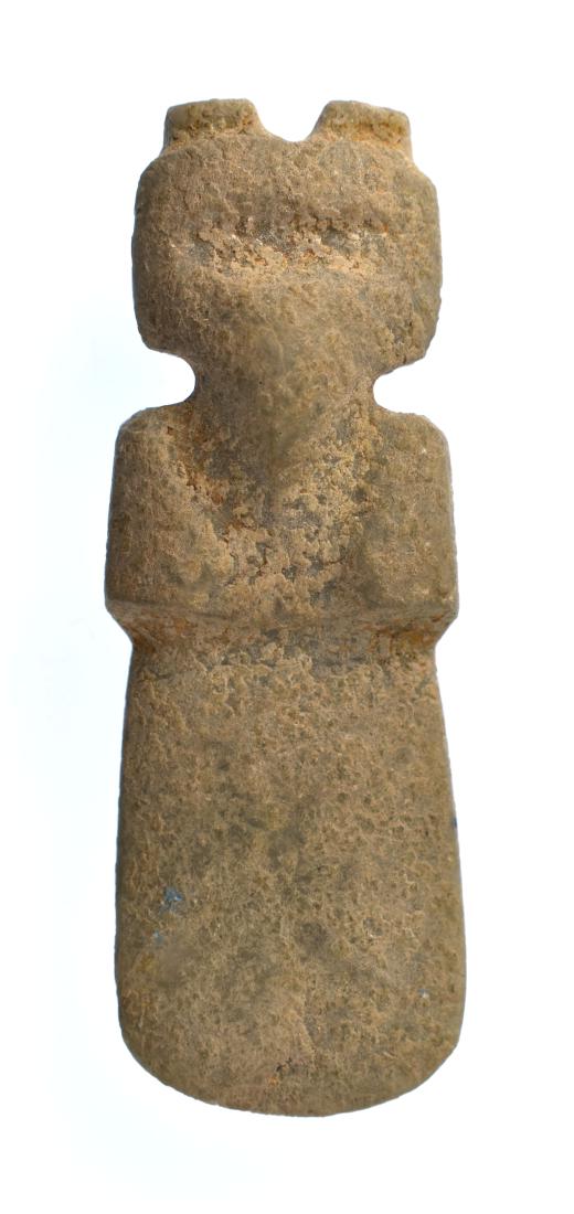 2 3/4" Jade Axe God: Pre-Columbian. Costa Rica. A.D. 1-500. Classic duckbill form. Perfect form and symmetry. Drilled for suspension. Calcified green Jade. Weighs 36 grams.